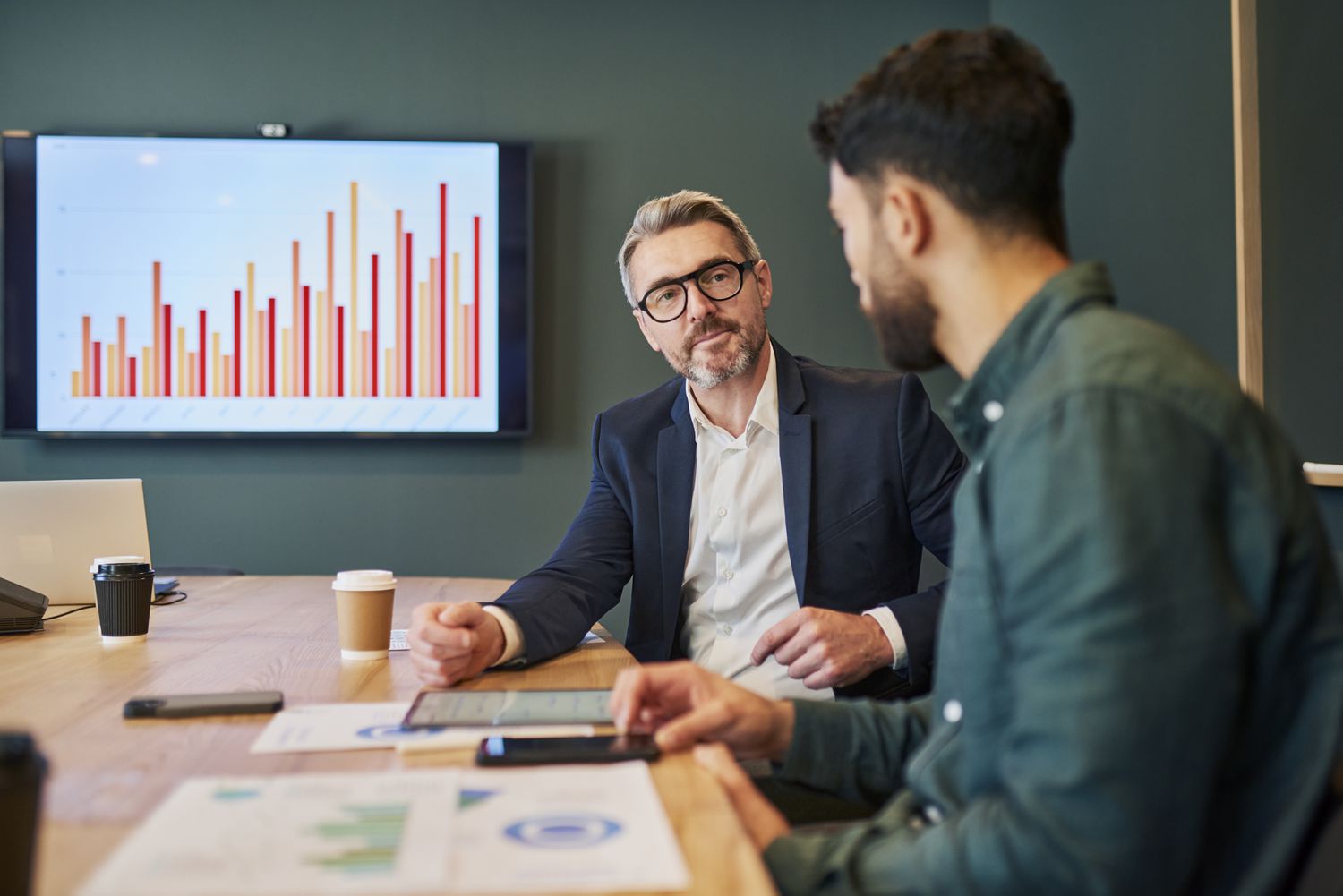 Accountants reviewing financial reports with a business client